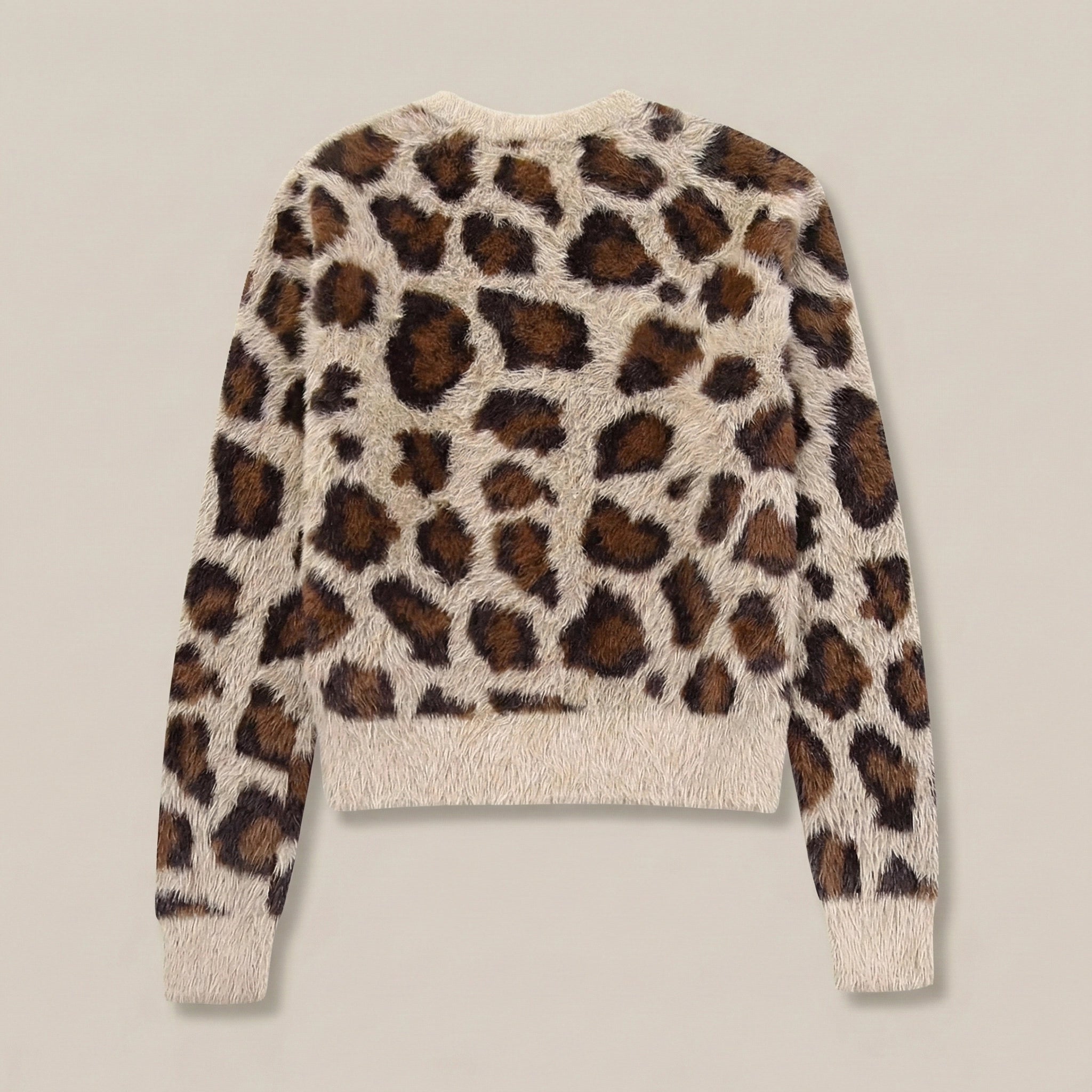 Leopard print sweater on a plain background