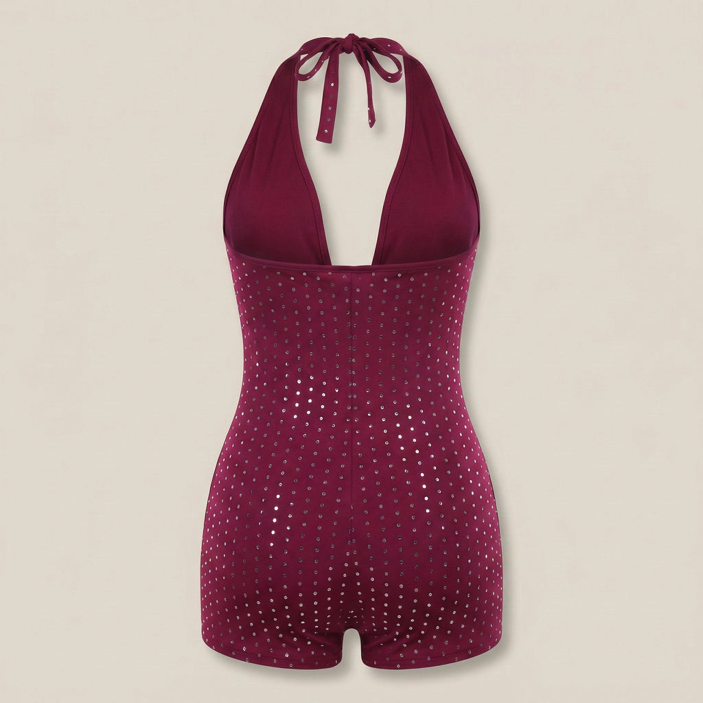 Magenta sequin swimsuit on a beige background