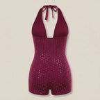 Magenta sequin swimsuit on a beige background