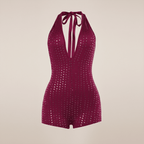 Purple sequin romper on a beige background