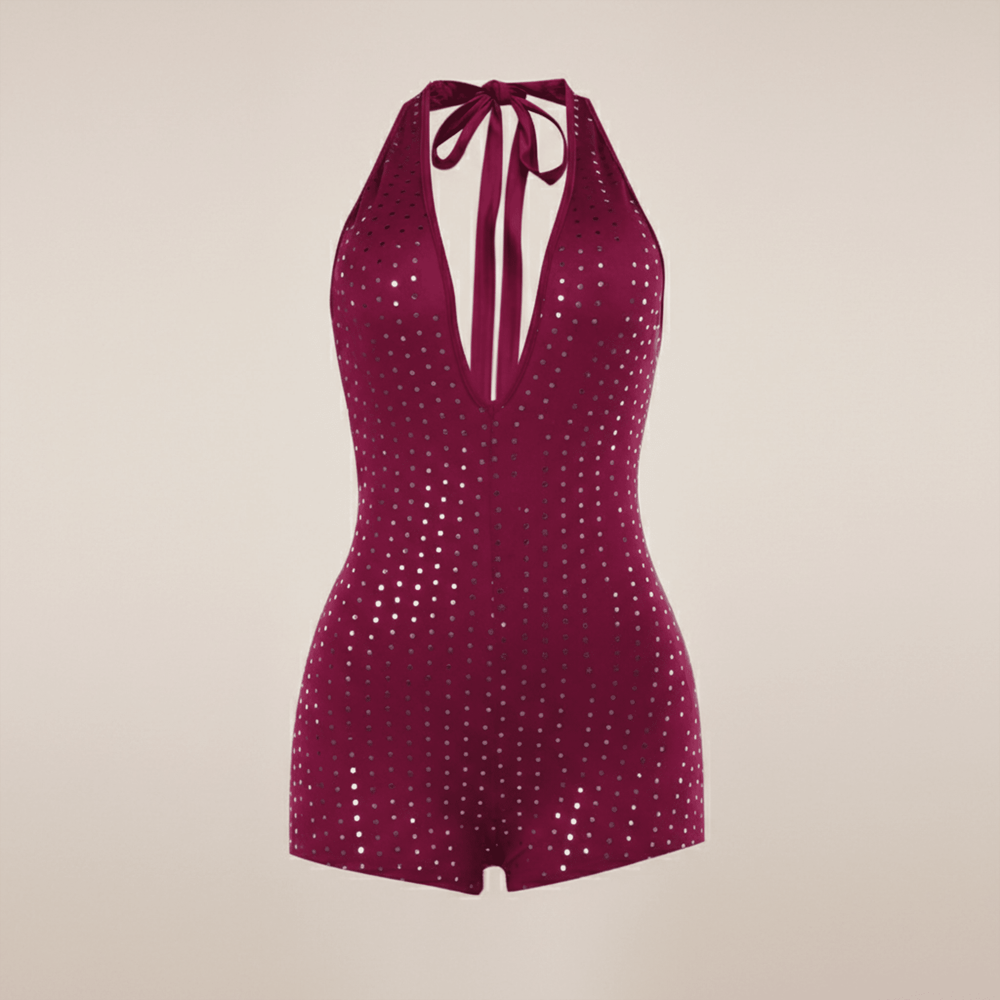 Purple sequin romper on a beige background