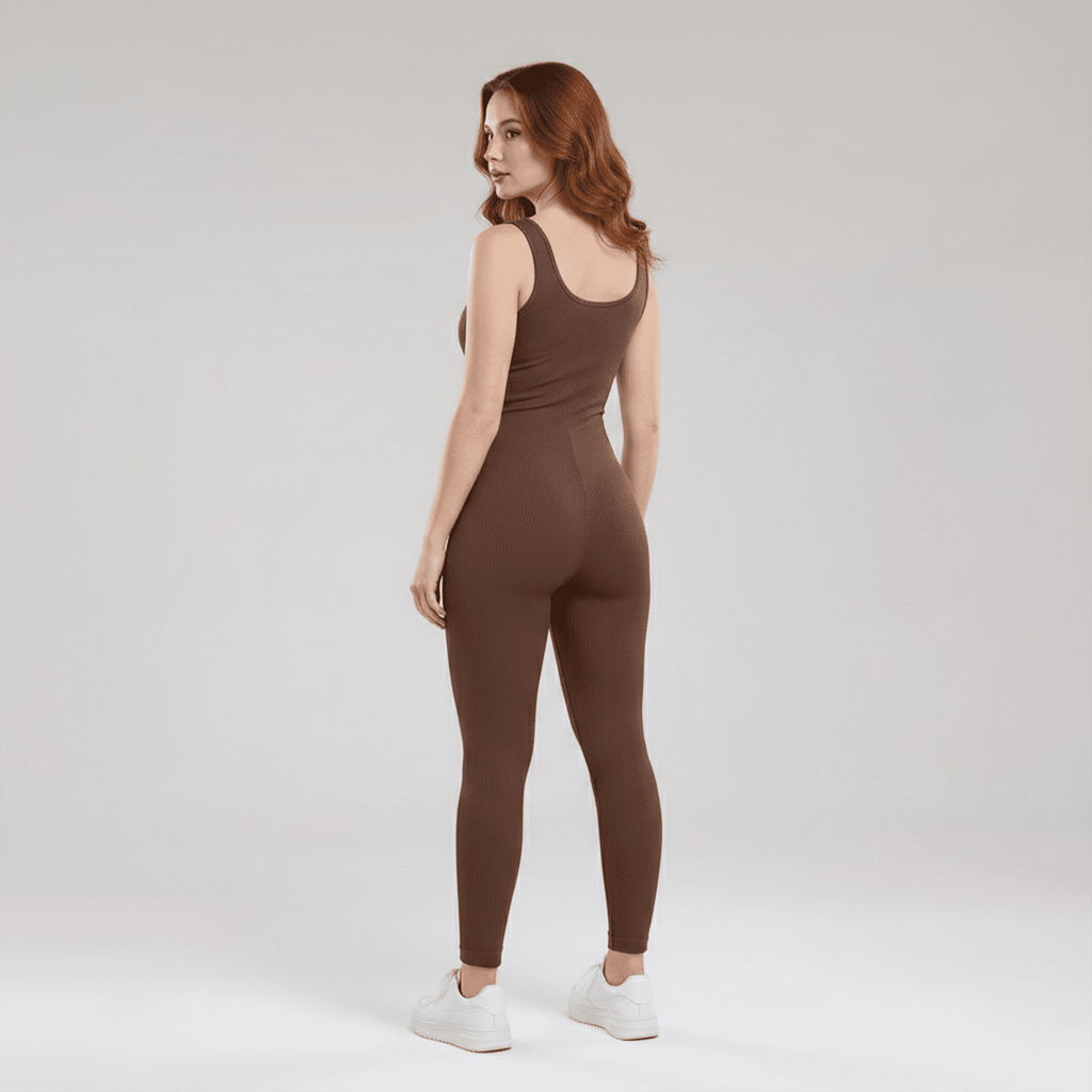 Woman wearing a brown jumpsuit on a white background