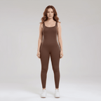 Woman wearing a brown jumpsuit on a white background