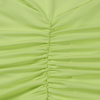 Close-up of green pleated fabric with a visible seam.