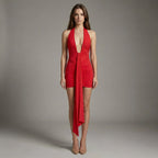 Woman wearing a red dress against a gray background