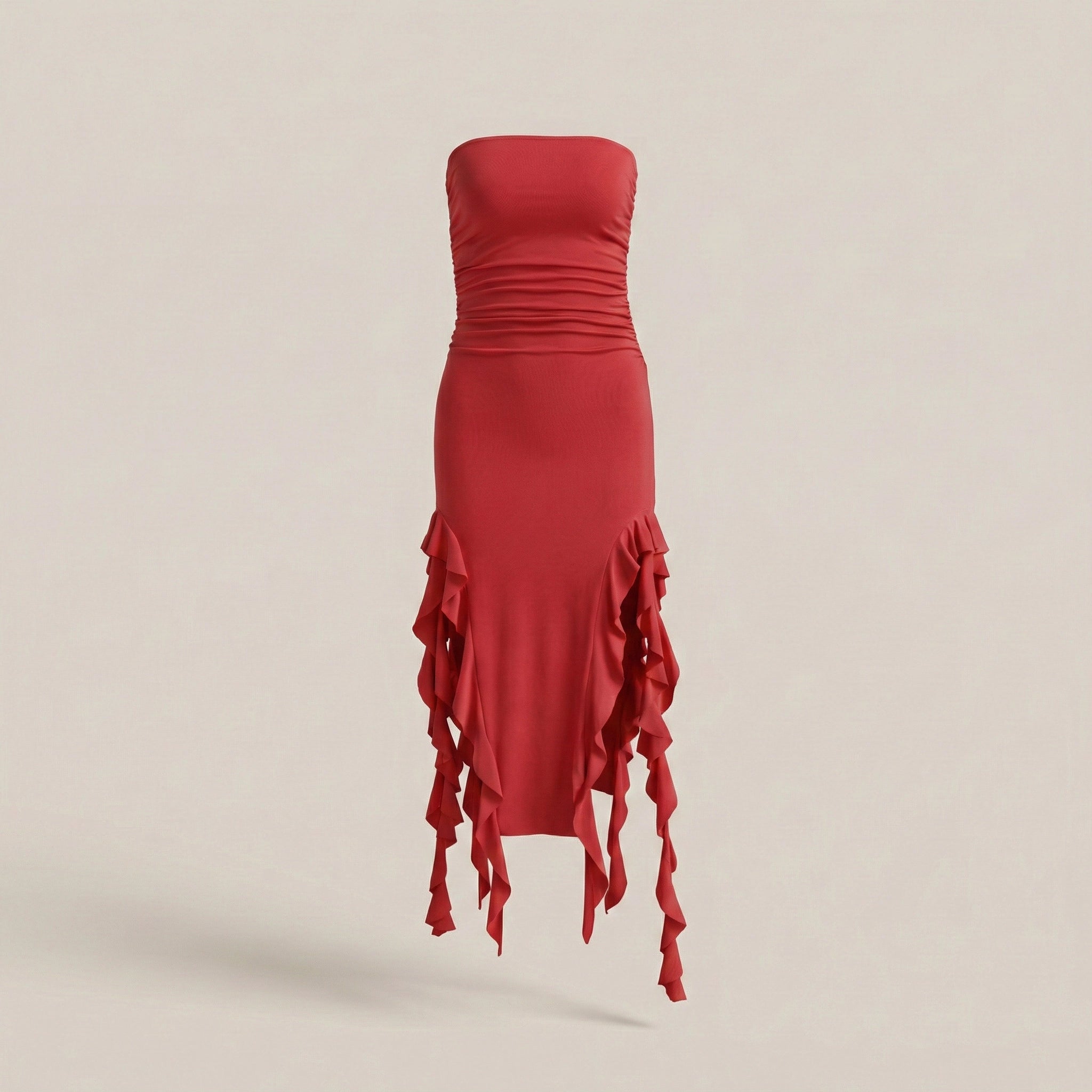 Red strapless dress with ruffled details on a beige background