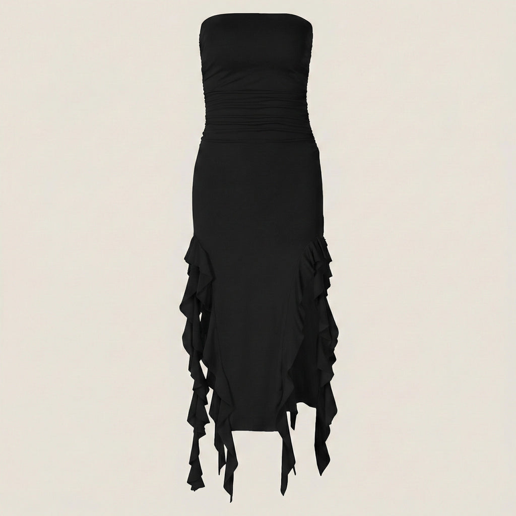 Black strapless dress with ruffled details on a beige background