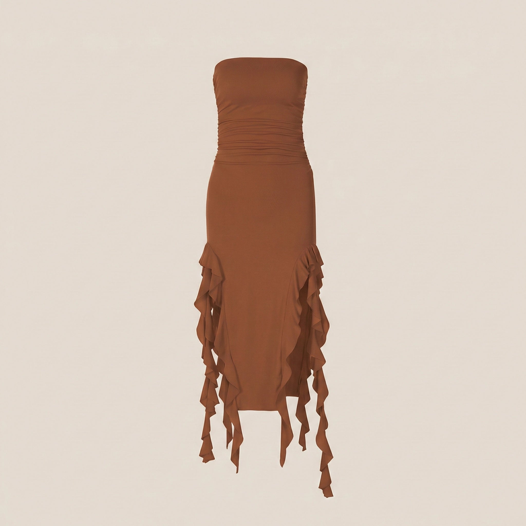 Brown strapless dress with ruffled skirt on a beige background