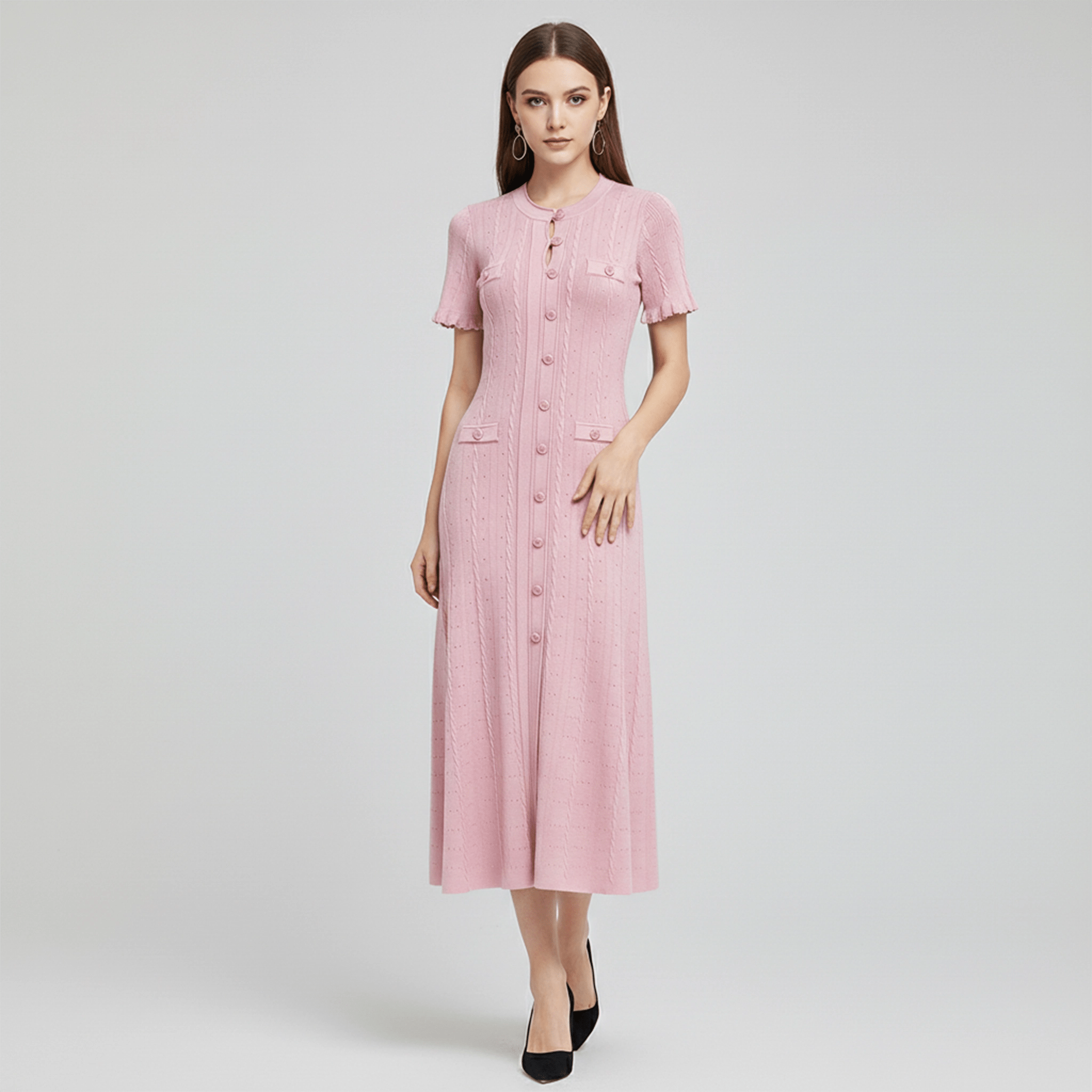 Woman wearing a pink dress on a white background