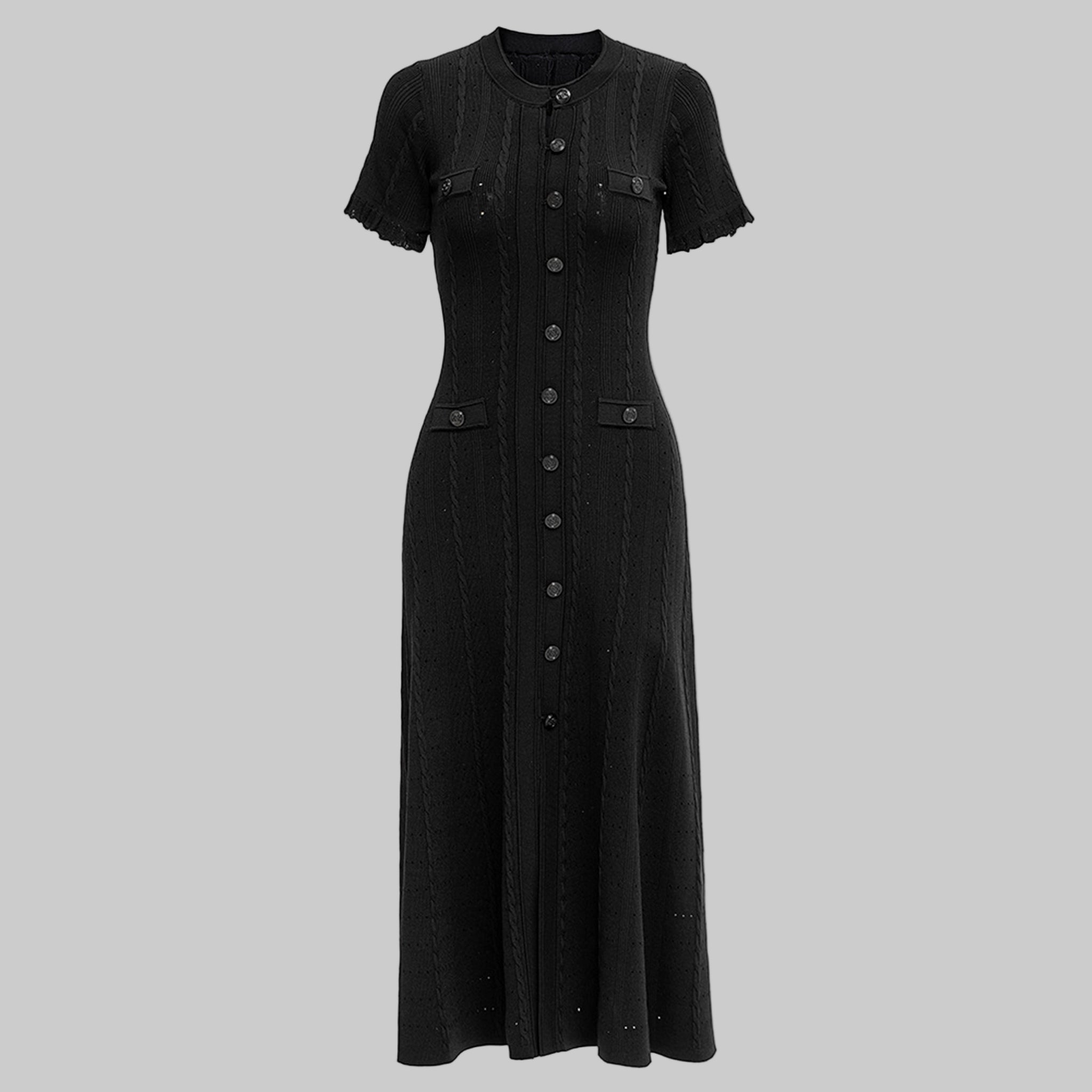 Black dress with buttons on a white background