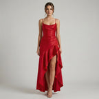 Woman wearing a red evening gown on a plain background