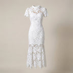 White lace dress on a beige background