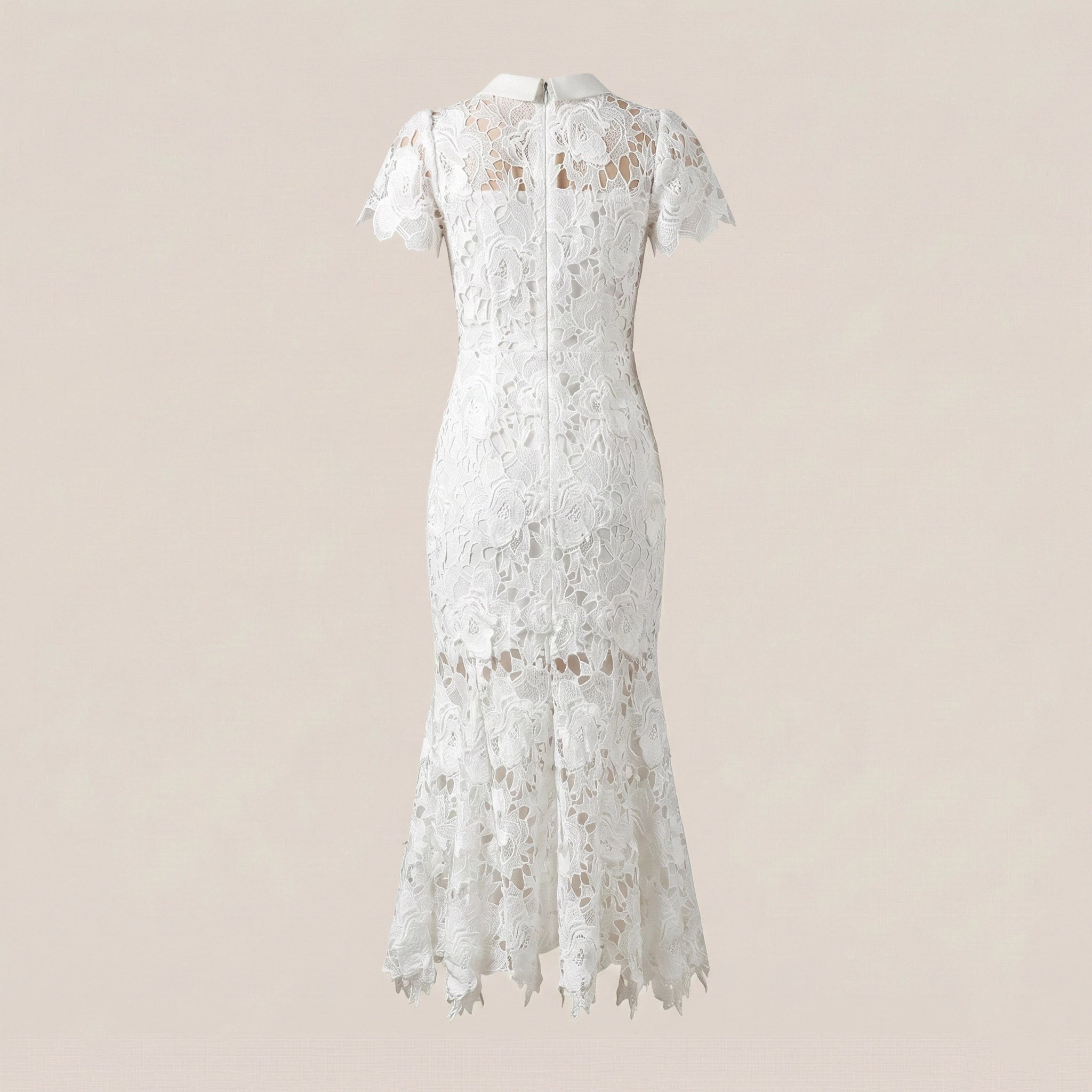 White lace dress on a beige background