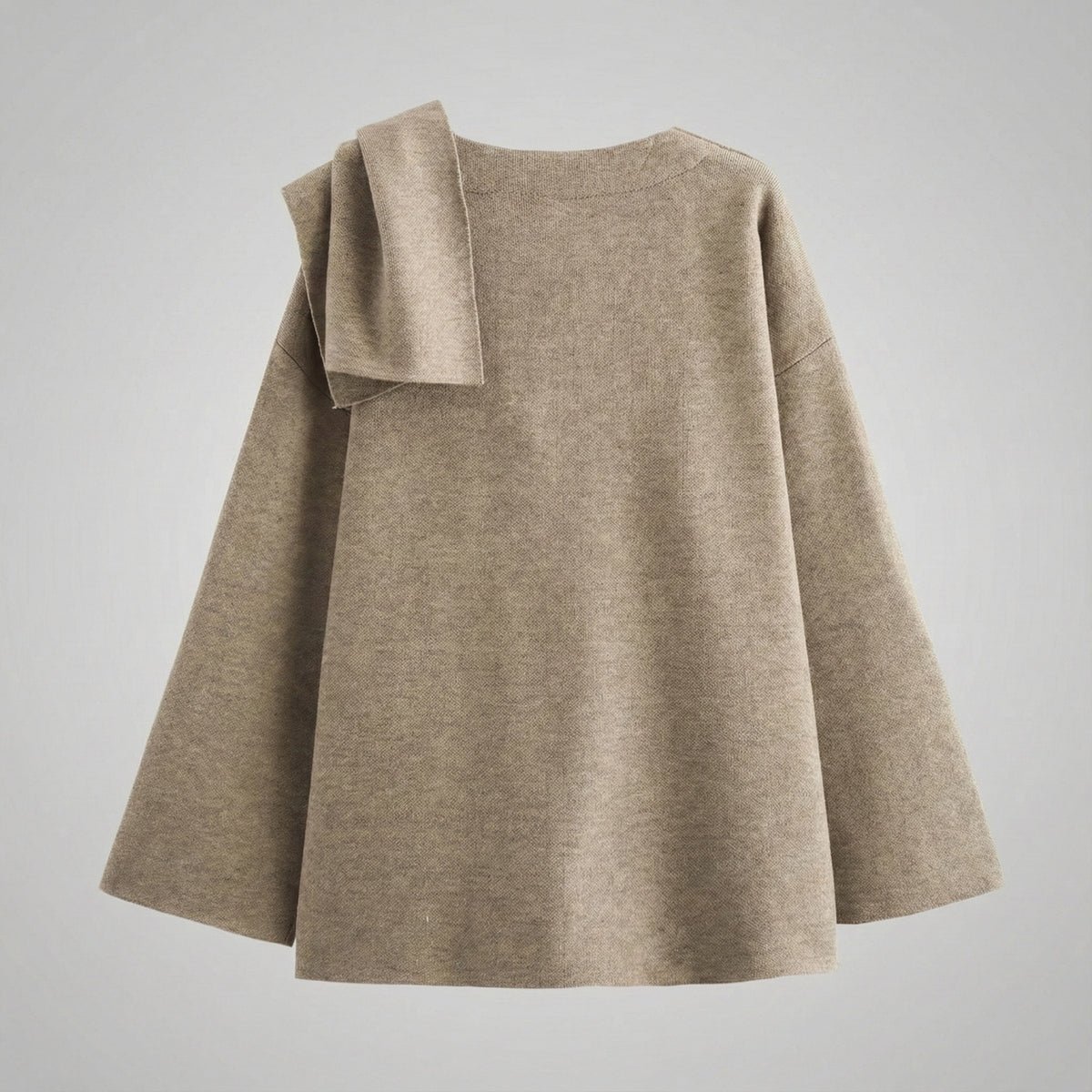 Beige sweater with a bow detail on a light gray background