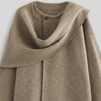 Brown hooded garment on a light gray background