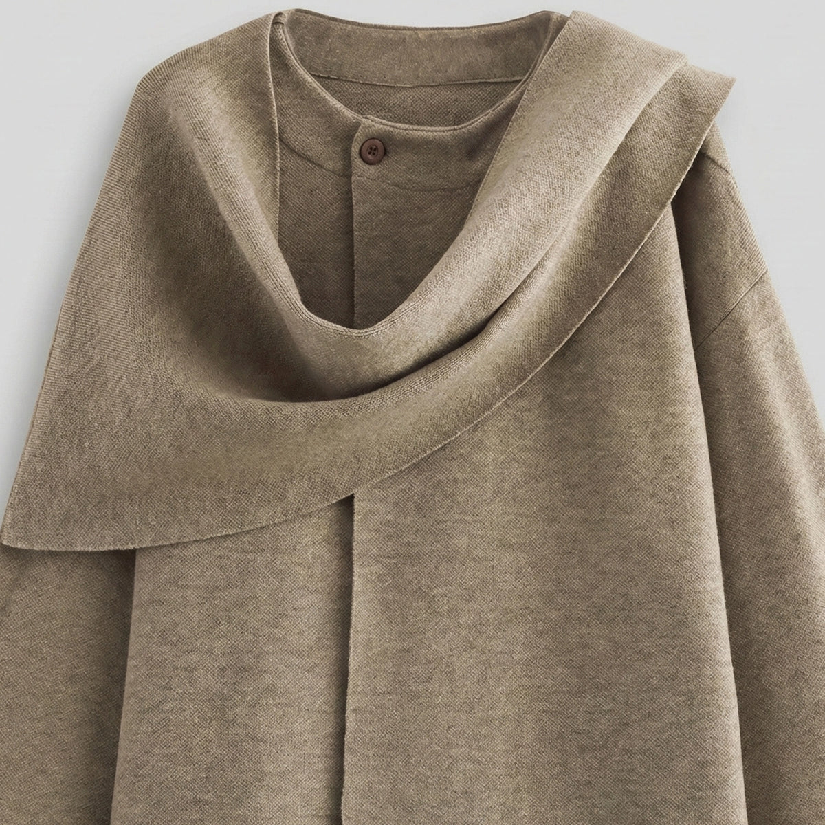 Brown hooded garment on a light gray background