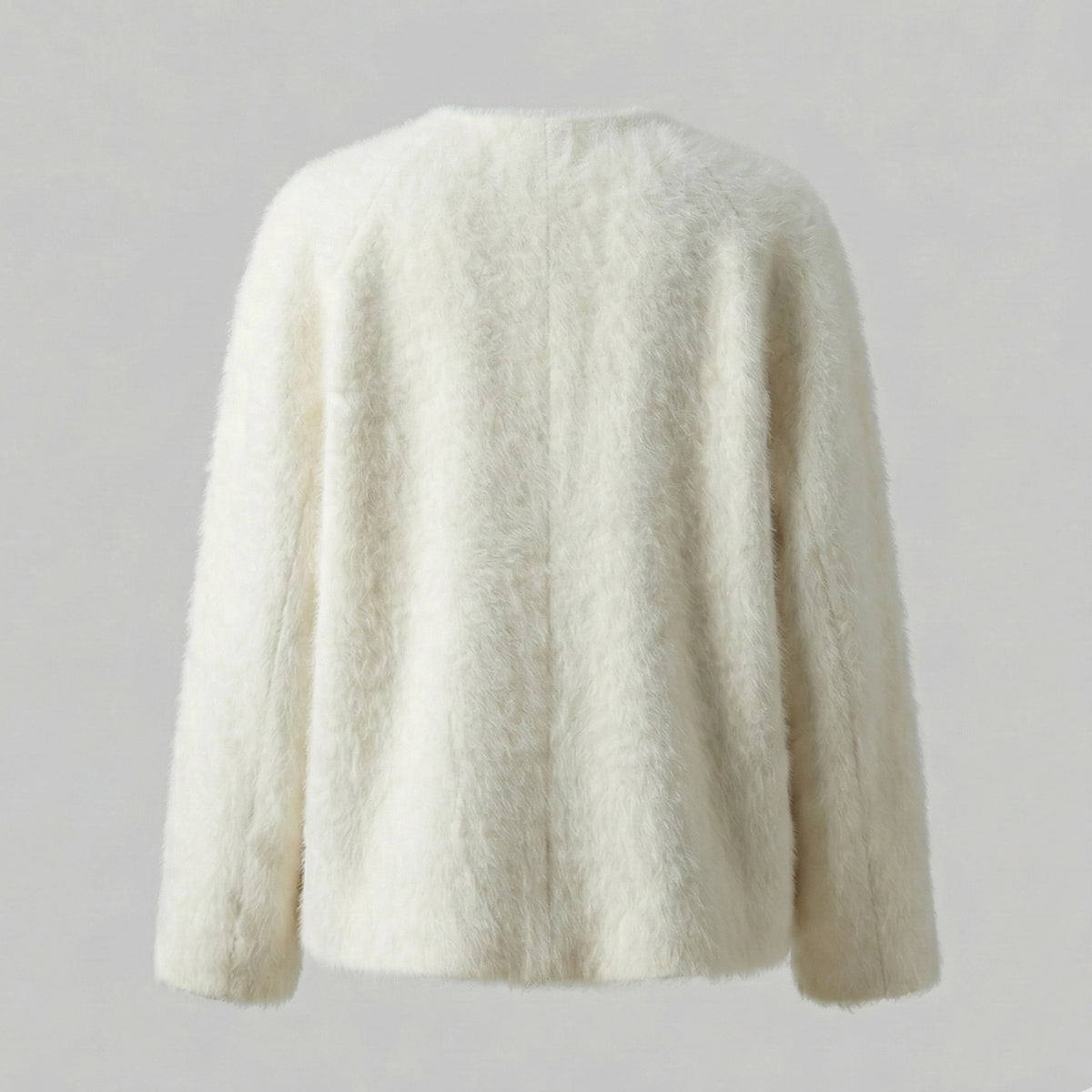 White fluffy sweater on a light gray background