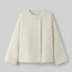 Cream-colored coat on a light gray background