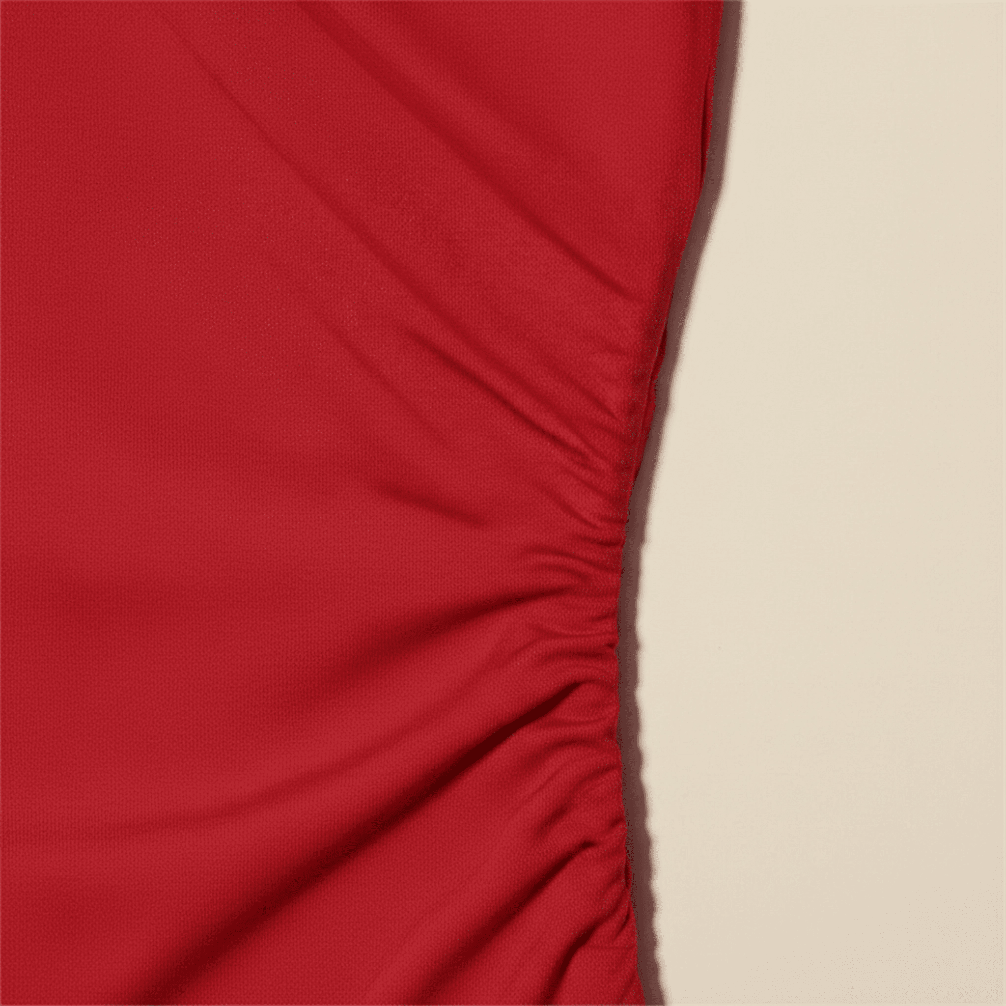 Red fabric with a beige background