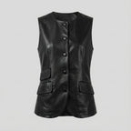 Black leather vest with button details on a light gray background