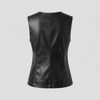 Black leather vest on a light gray background