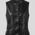 Black leather vest with button details on a light gray background