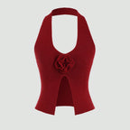 Red halter top with a floral detail on a white background