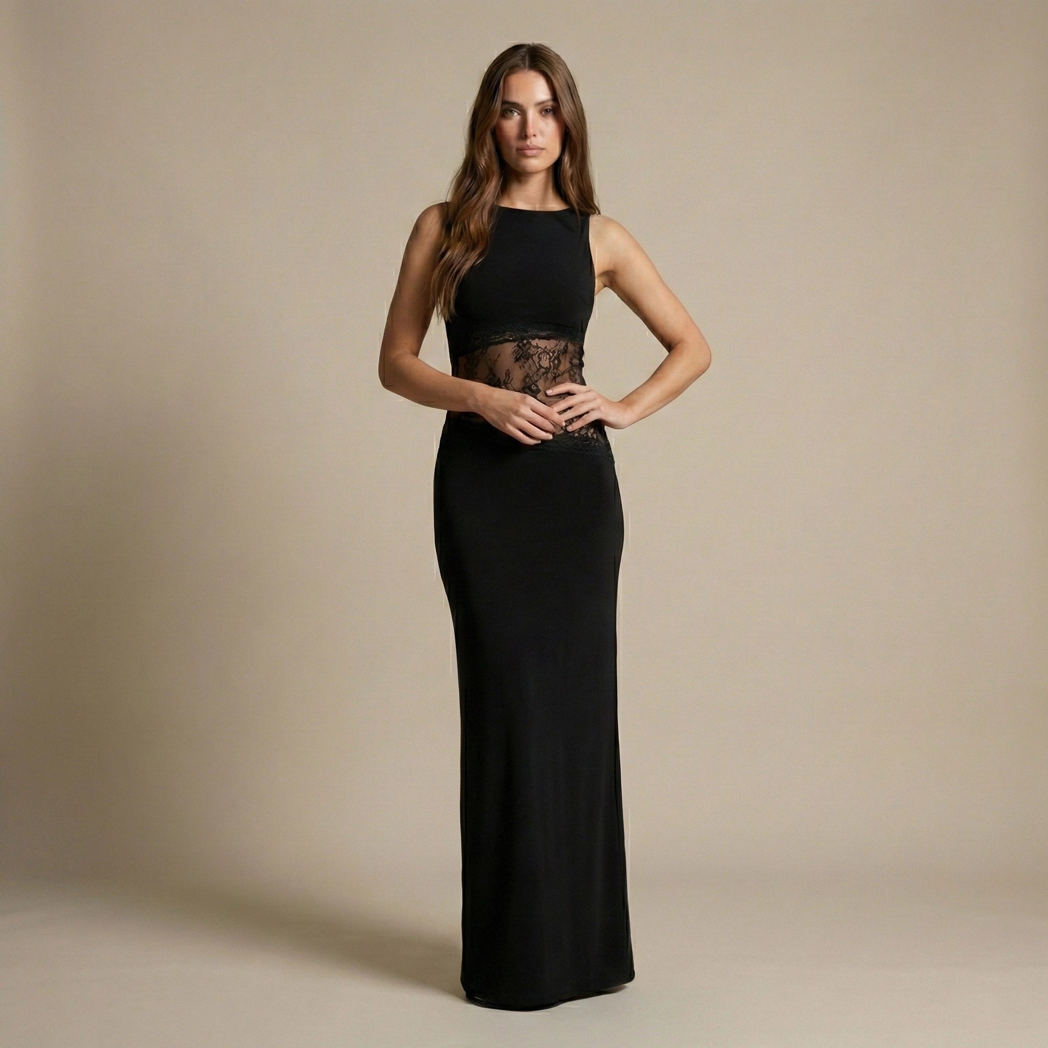 Woman wearing a black evening gown against a beige background