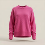 Pink sweater on a beige background