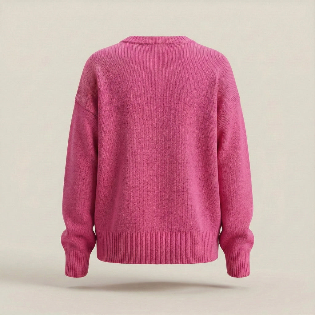 Pink sweater on a beige background