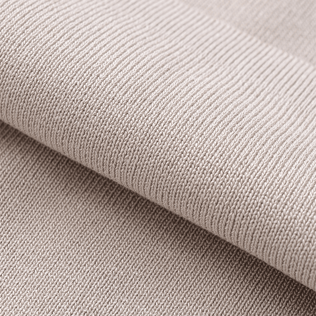 Close-up of beige fabric with a textured pattern