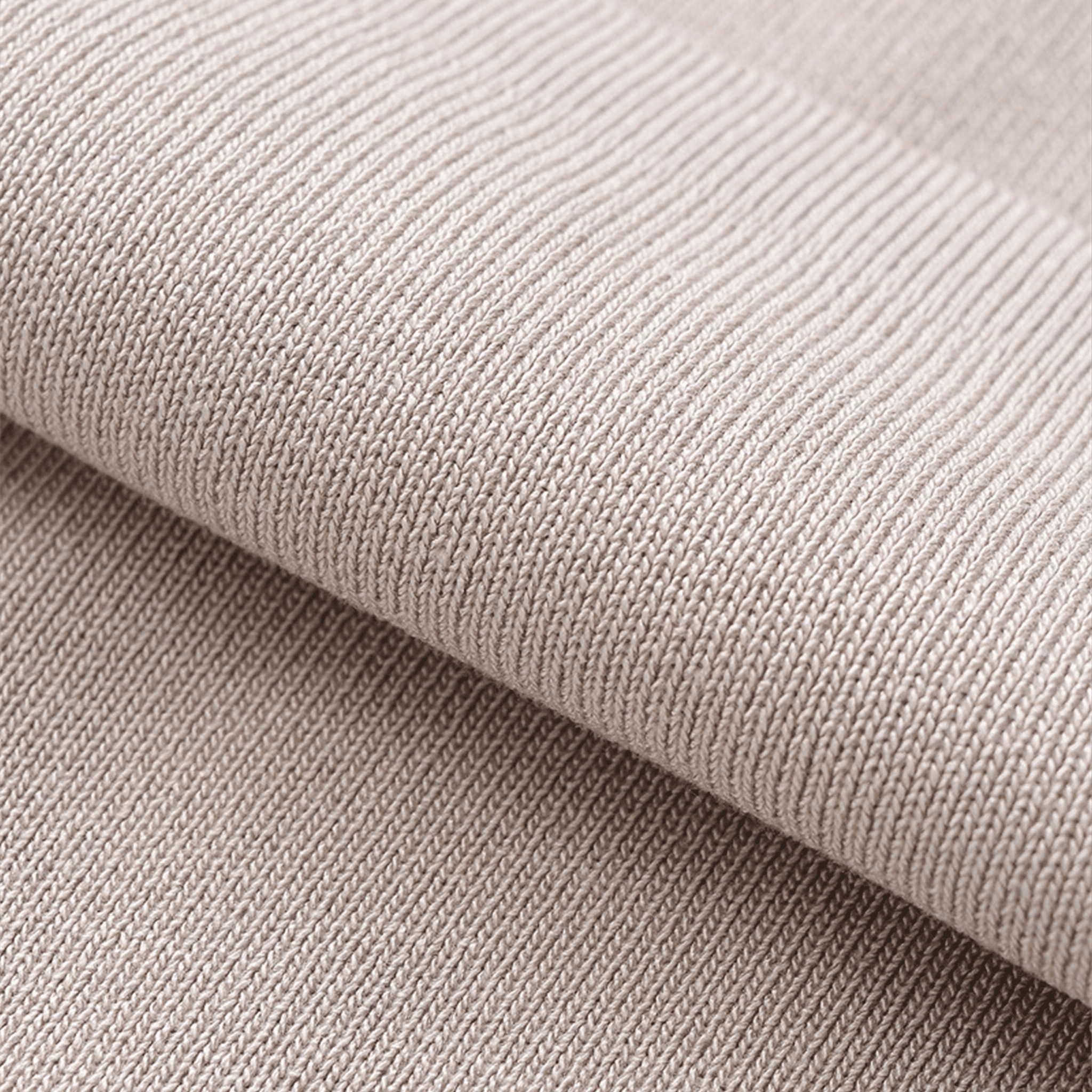 Close-up of beige fabric with a textured pattern