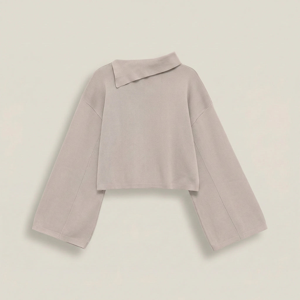Light purple sweater on a light beige background