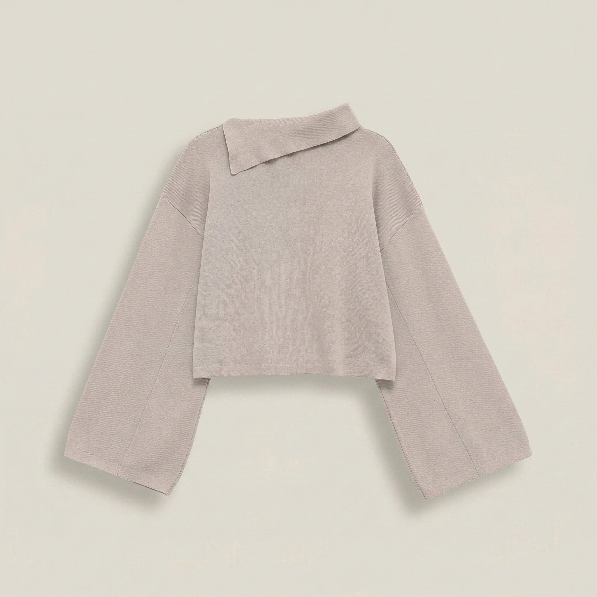 Light purple sweater on a light beige background