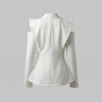 White blazer on a light gray background