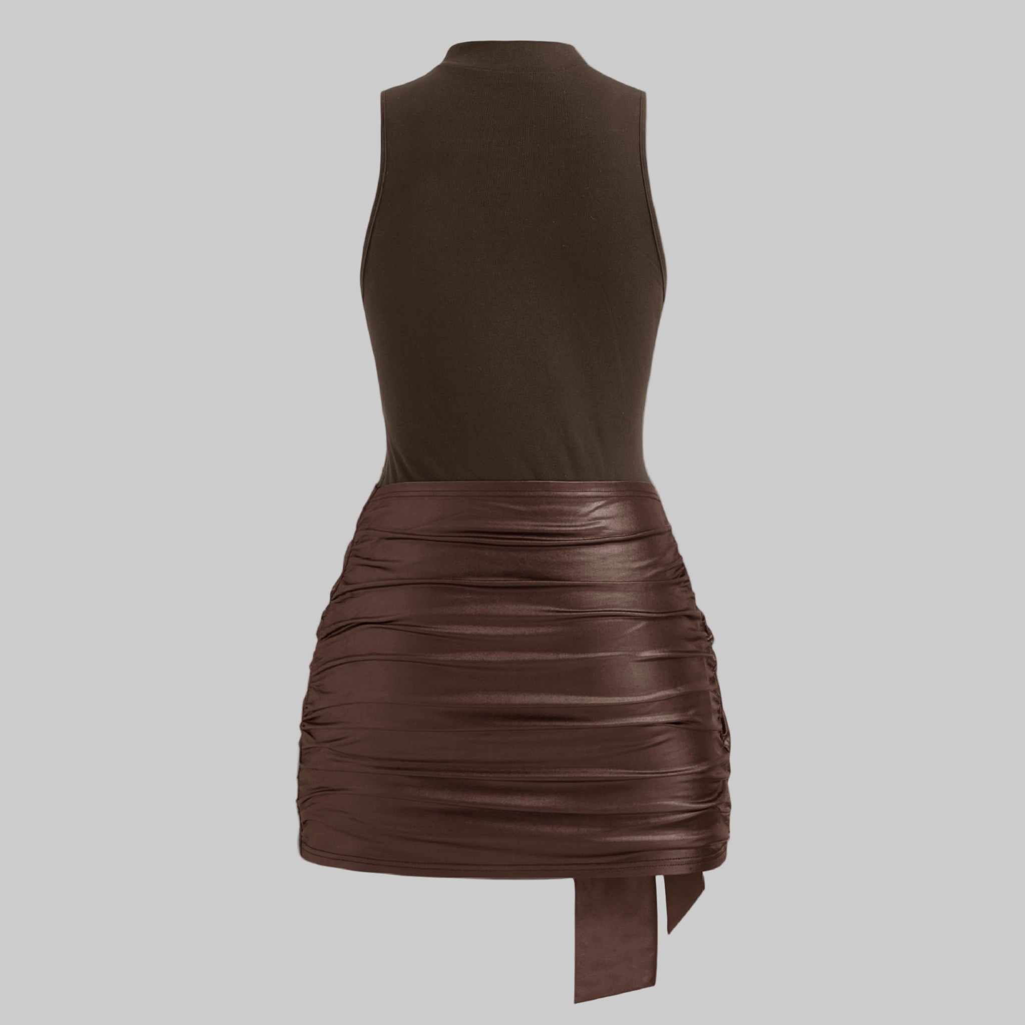 Brown dress with ruched skirt on a light gray background