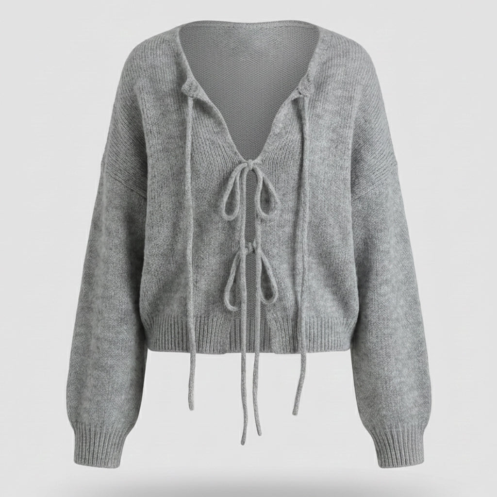 Gray knitted cardigan with tie details on a light gray background