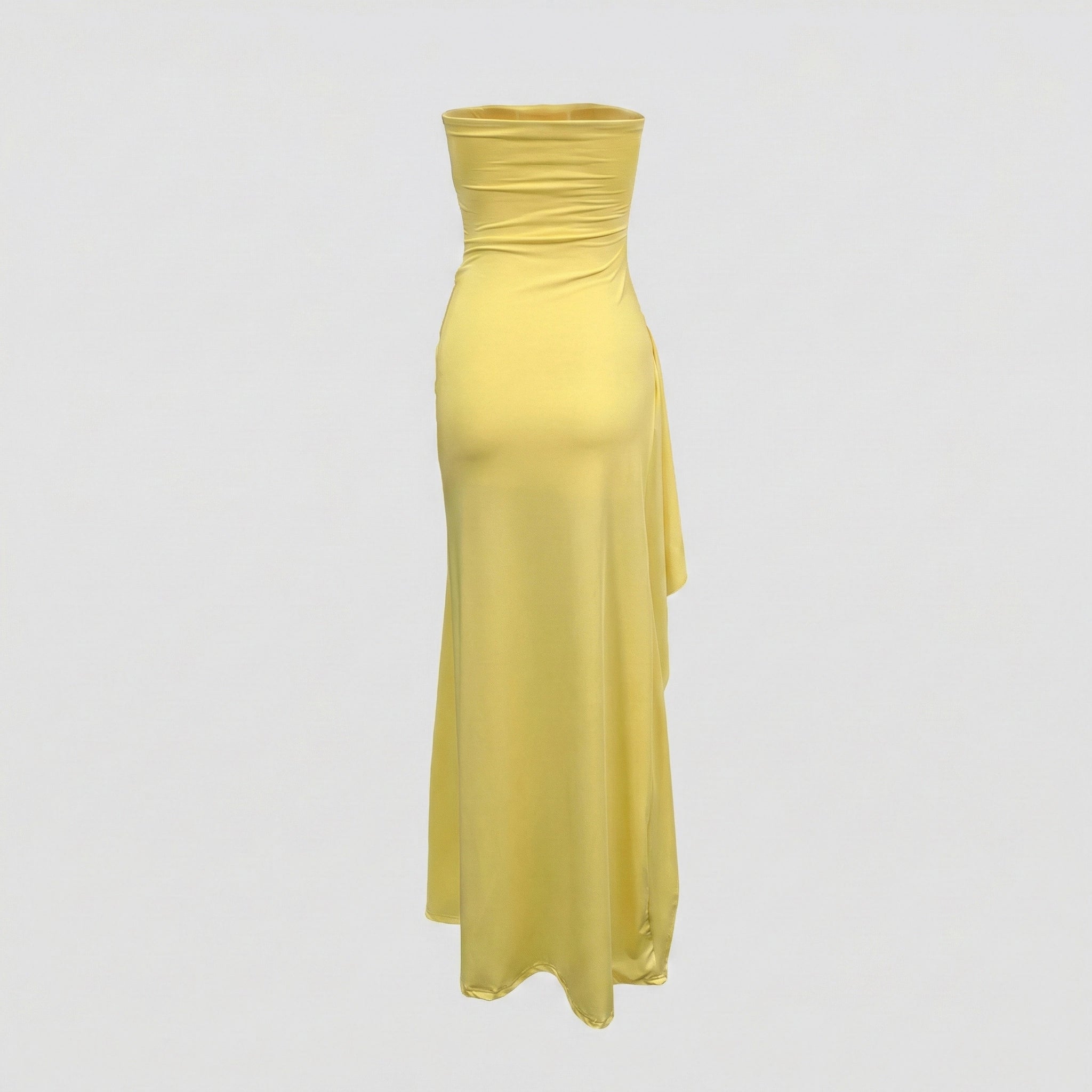 Yellow strapless dress on a light gray background