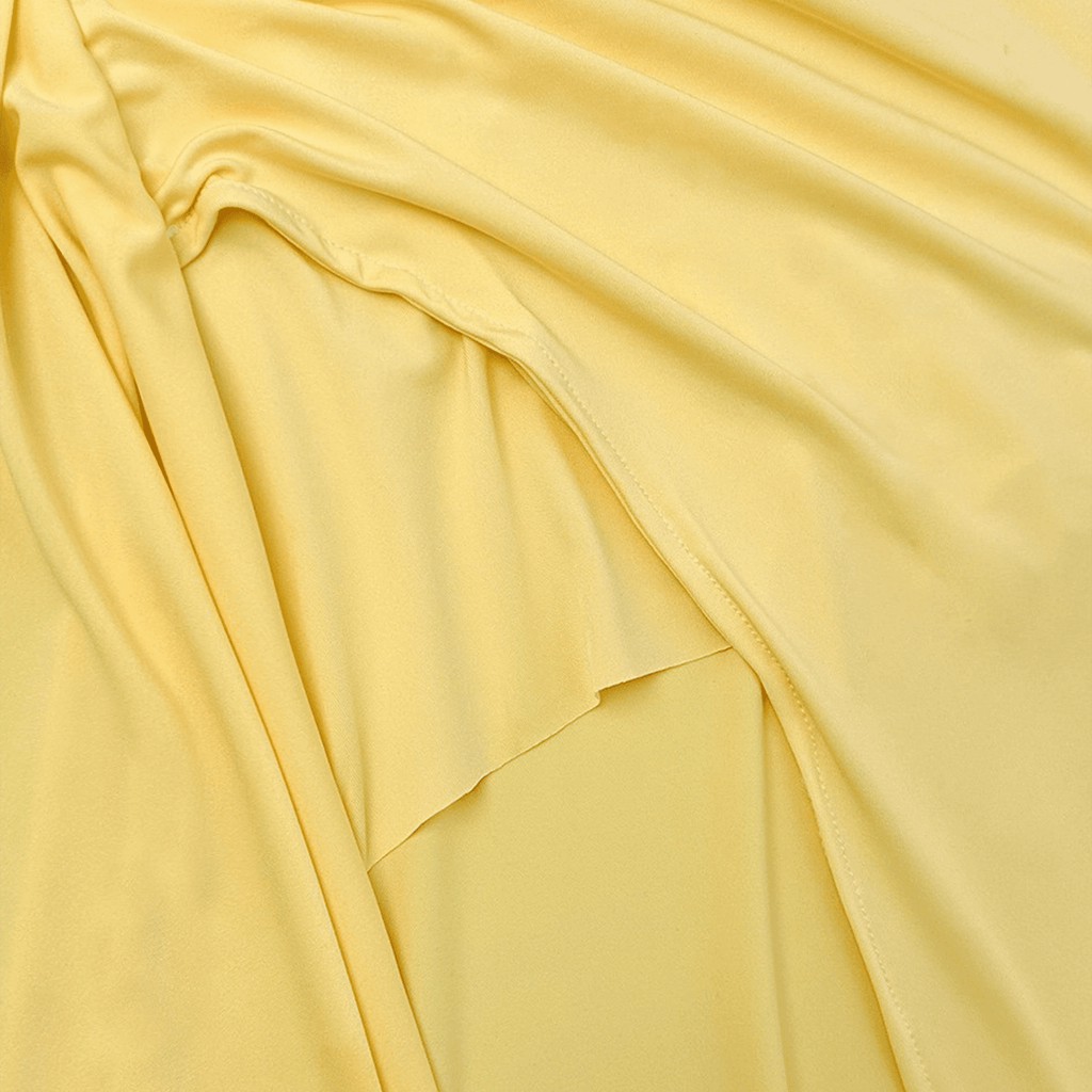 Close-up of yellow fabric with folds