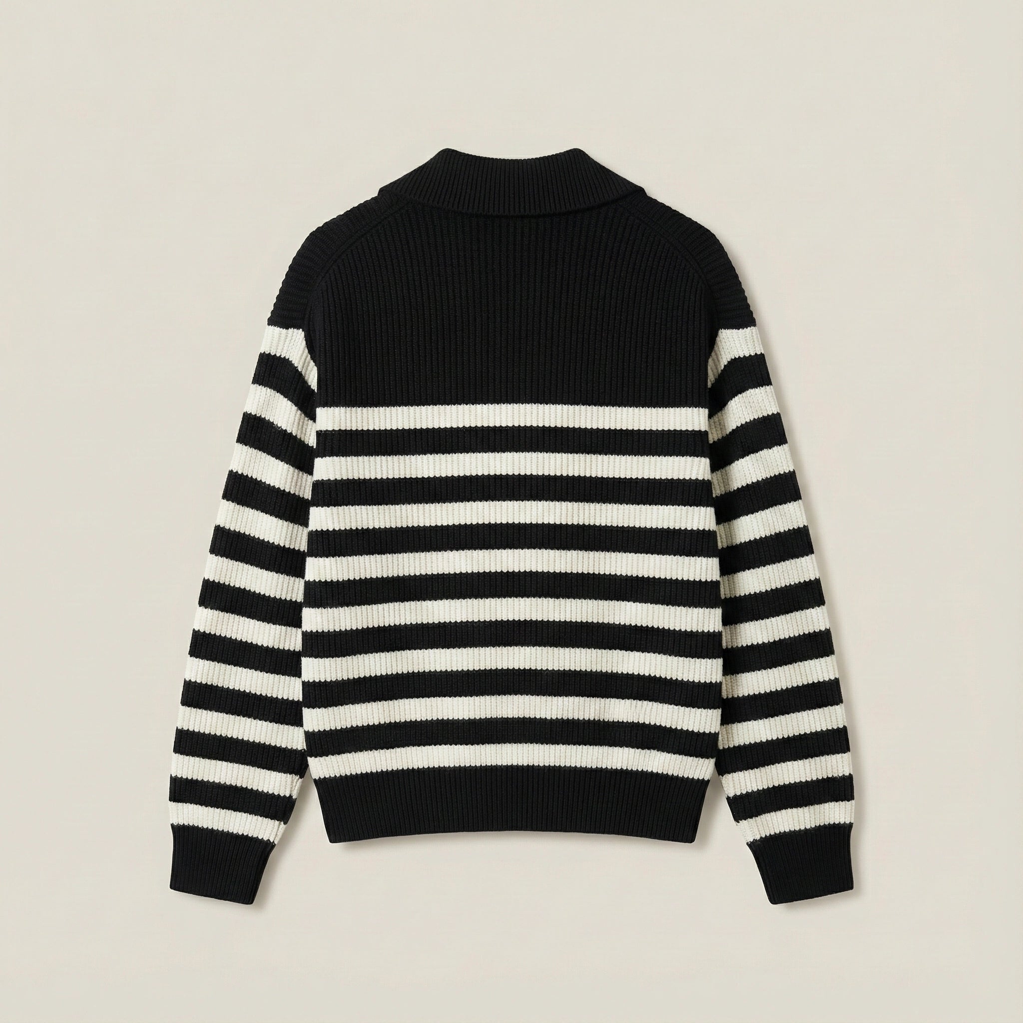 Black and white striped sweater on a beige background