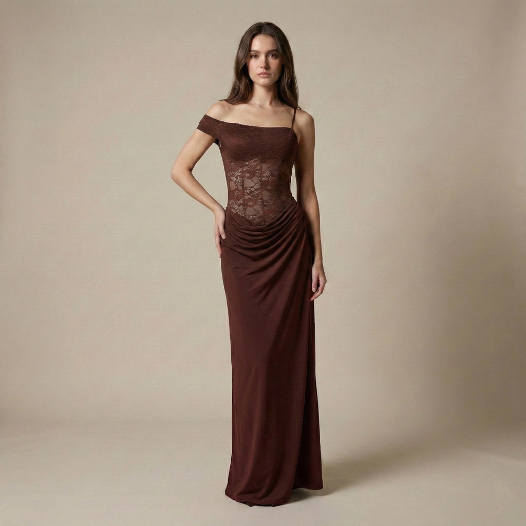 Woman wearing a brown off-shoulder evening gown against a beige background