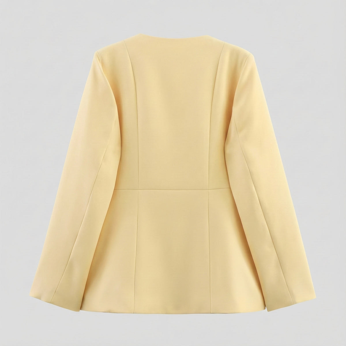 Light yellow blazer on a light gray background