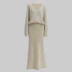 Beige long-sleeve top and skirt set on a white background