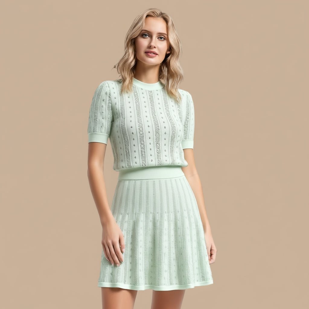 Woman wearing a light green lace dress against a beige background