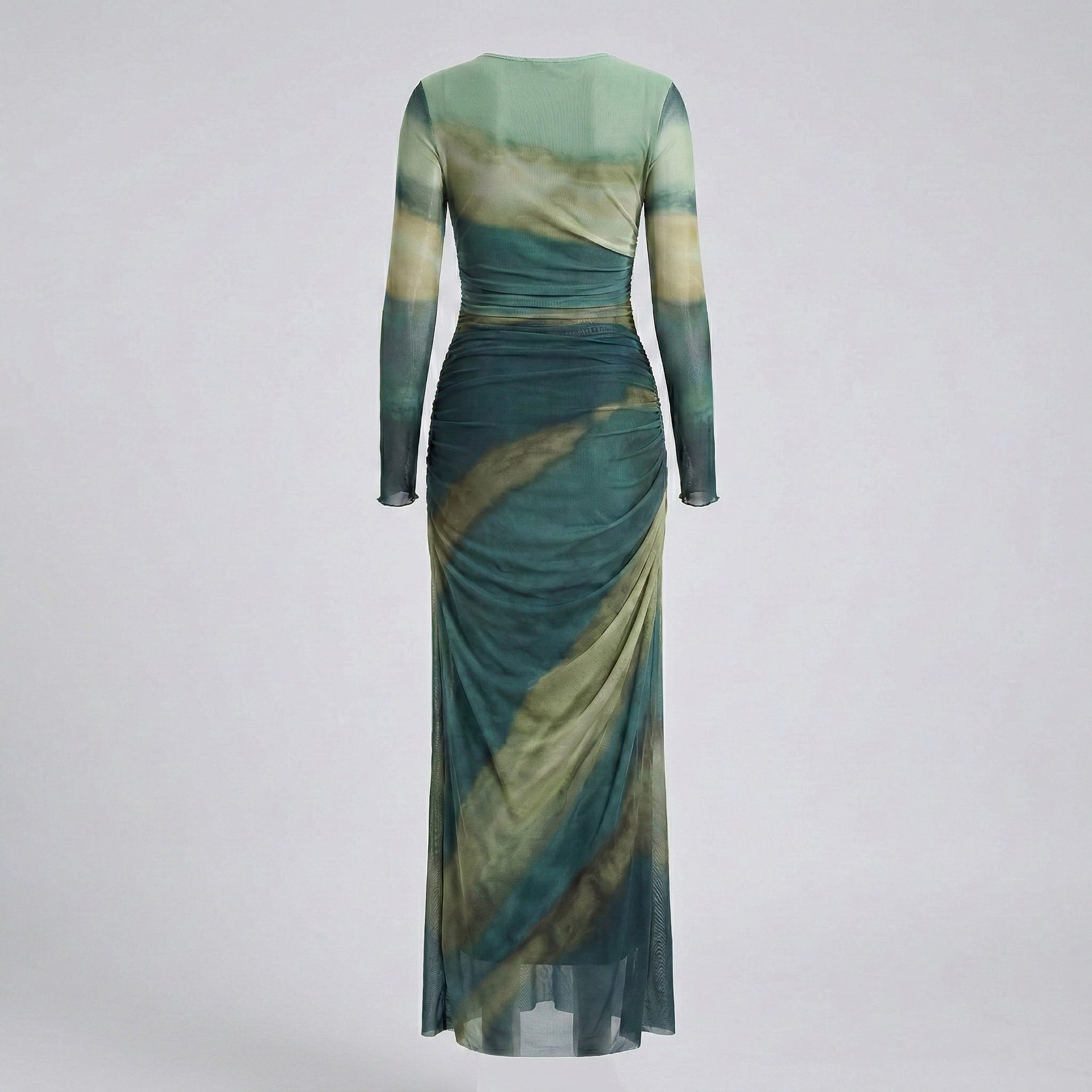 Green and beige dress with long sleeves on a light gray background