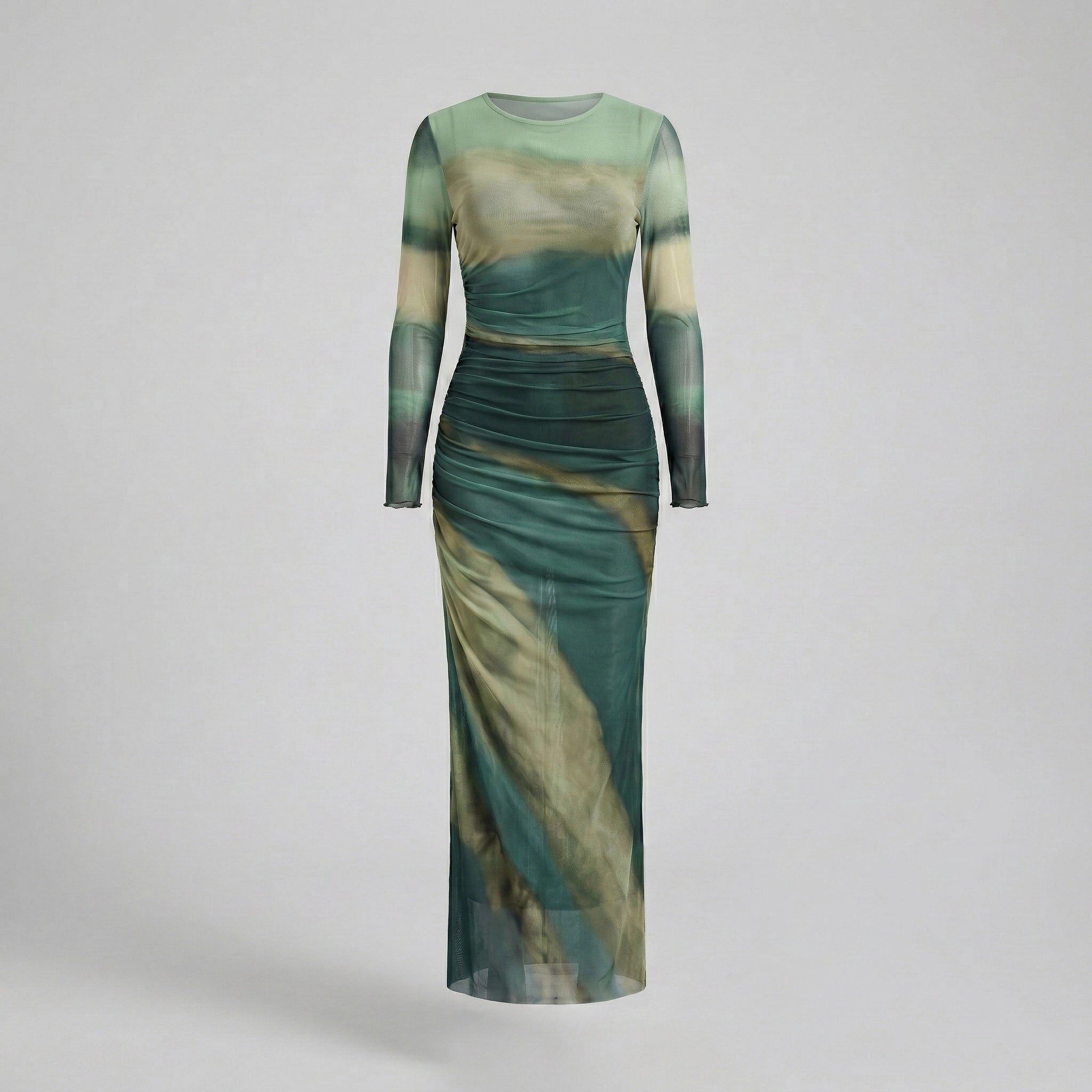 Green and beige dress with long sleeves on a light gray background