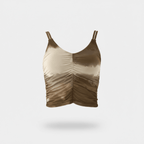 Gold tank top with ruched design on a light gray background
