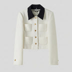 White jacket with black collar and gold buttons on a light gray background
