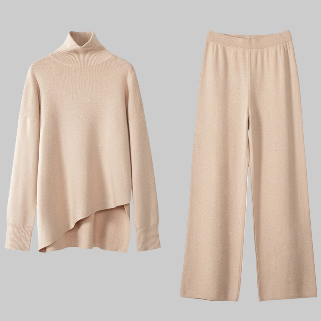 Beige sweater and pants set on a white background