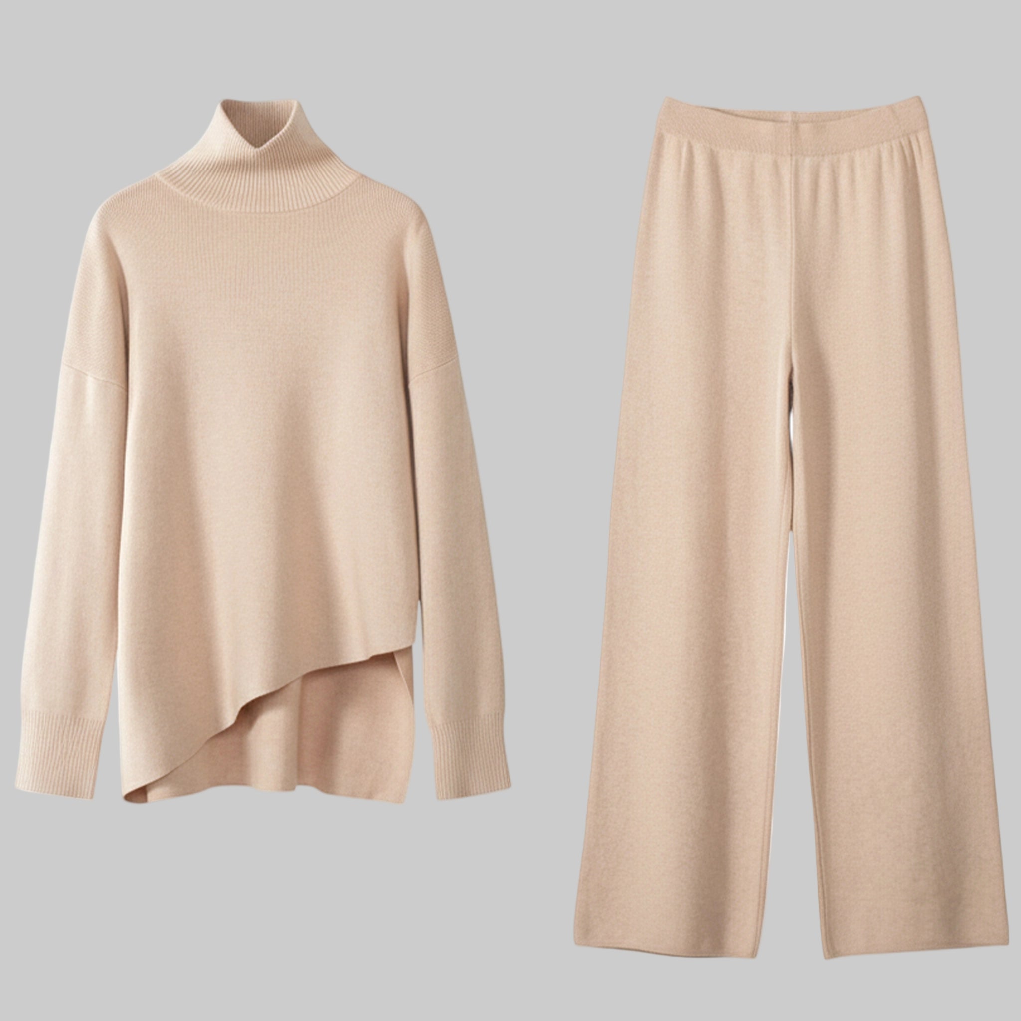 Beige sweater and pants set on a white background